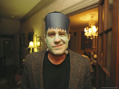 A Man Dresses as Frankensteins Monster for Halloween