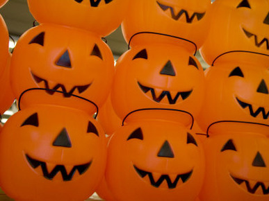 Colorful Plastic Jack-O-Lanterns Grin at the Approach of Halloween