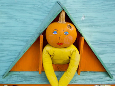 Painted Pumpkin Figure Awaits Halloween