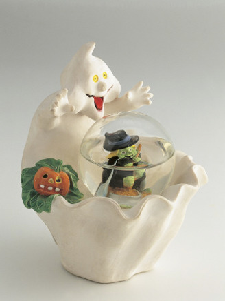 Close-Up of the Figurine of Halloween Ghost with a Snow Globe